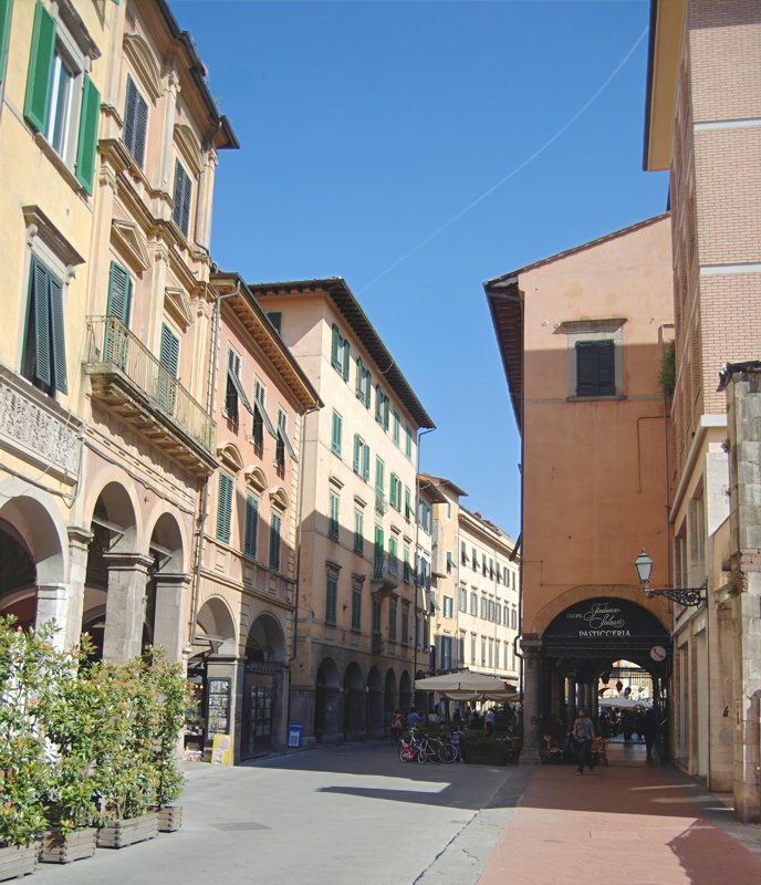 20 - The historic Borgo Stretto pedestrian street in Pisa, Italy, famous for its medieval architecture, open-air cafes, and characteristic covered porticos